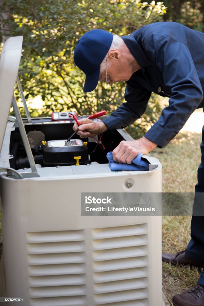 Technician servicing generator and backup power equipment